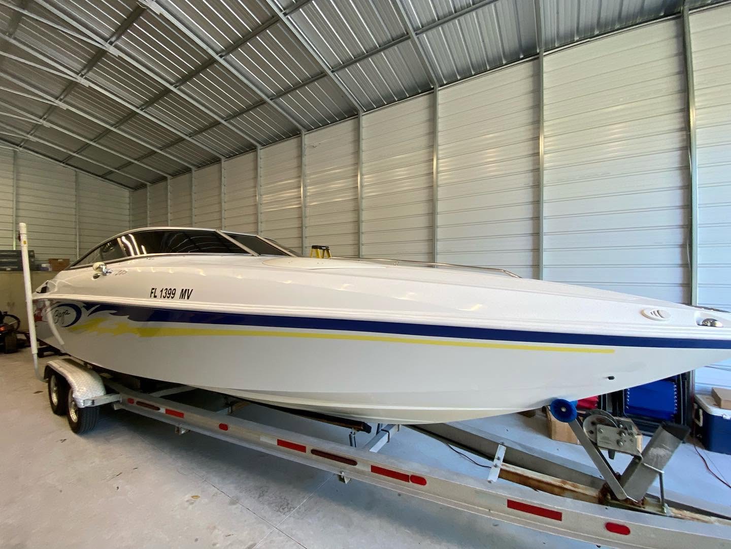 Offshore boat with tinted windshield inside climate-controlled shop, Mitchell's Tinting