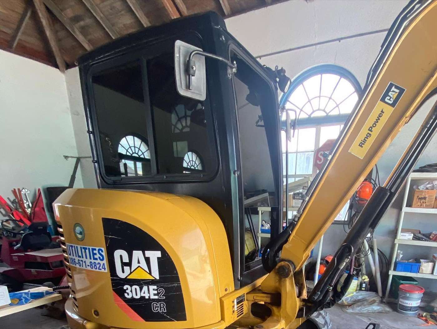 Construction equipment cab glass with ceramic tint film