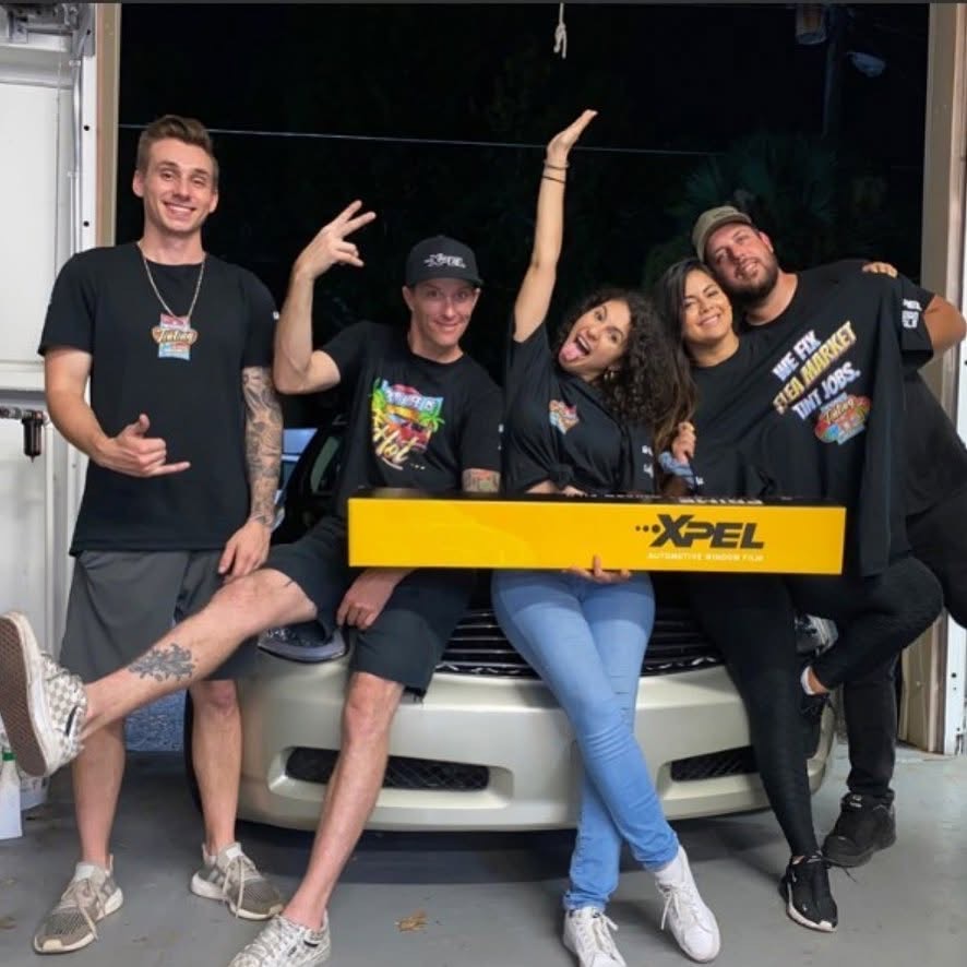 The Mitchell's Tinting team in their Port Orange, FL shop